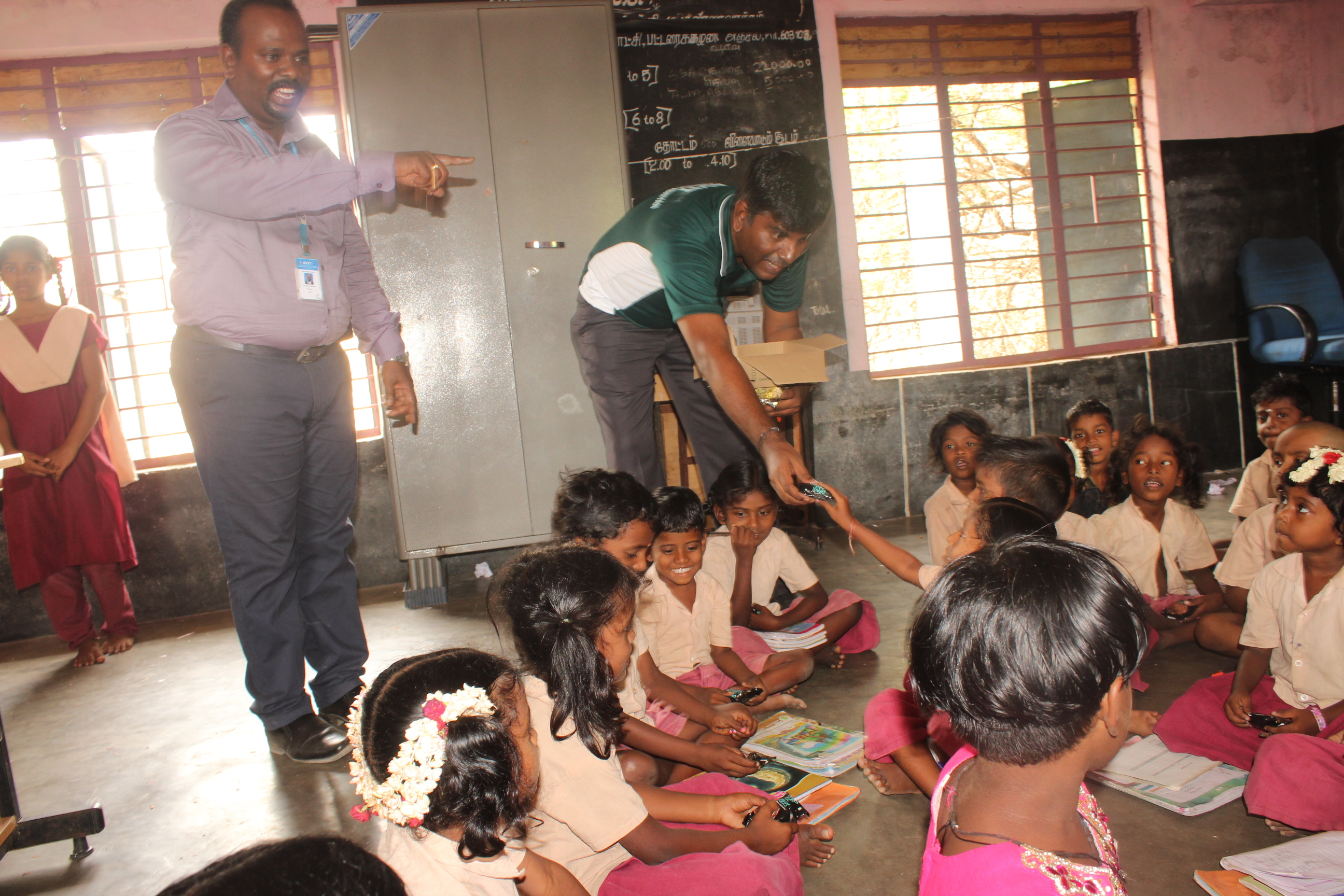 Distribution of Snacks to Naduvakkarai Govt. Primary School Students by UBA student volunteers
